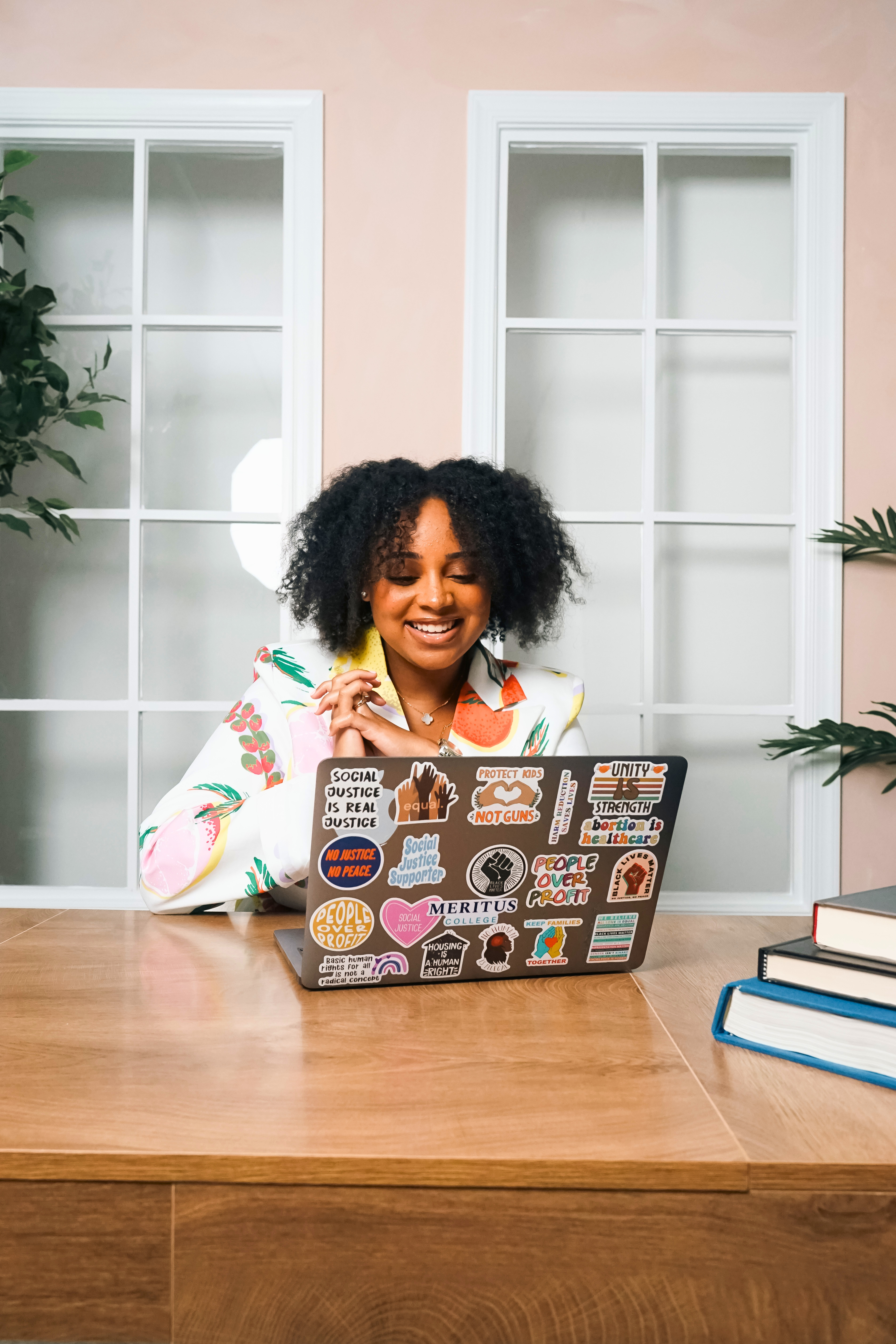 Black woman laughing confidently in a professional meeting